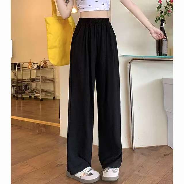 Pantalon palazzo large en look lin pour femmes avec taille haute, ceinture élastique et poches
