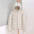Veste courte matelassée ultralégère pour femmes avec isolation thermique, capuche ergonomique et design compressible Echo Archiv