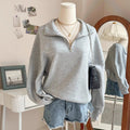 Sweatshirt oversize pour femmes avec demi-fermeture éclair, col montant et manches ballon Echo Archiv