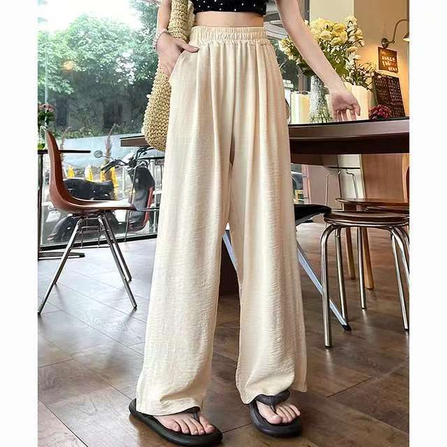 Pantalon palazzo large en look lin pour femmes avec taille haute, ceinture élastique et poches