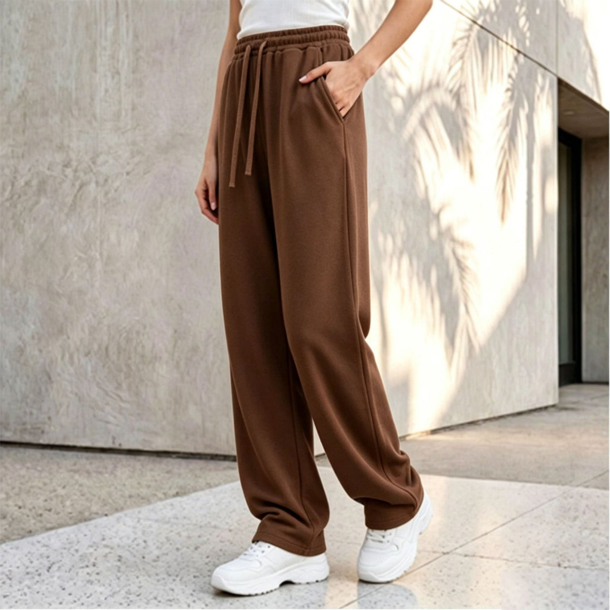 Pantalon palazzo lounge pour femmes avec taille confortable, cordon de serrage, poches latérales et couture décorative Echo Archiv