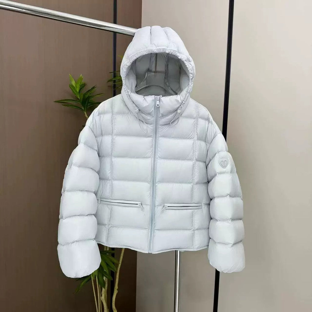Veste thermo matelassée courte pour femmes avec capuche, poches zippées et bords élastiques Echo Archiv