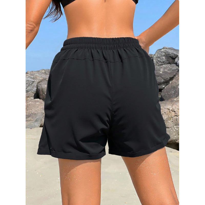 Shorts de sport pour femmes avec taille élastique et poches latérales pratiques R&B