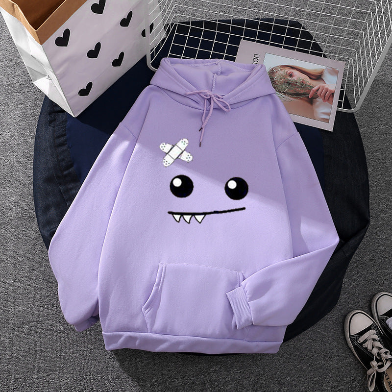 Sweat à capuche pour femmes avec un visage de monstre ludique, application de bandage et poche kangourou Echo Archiv