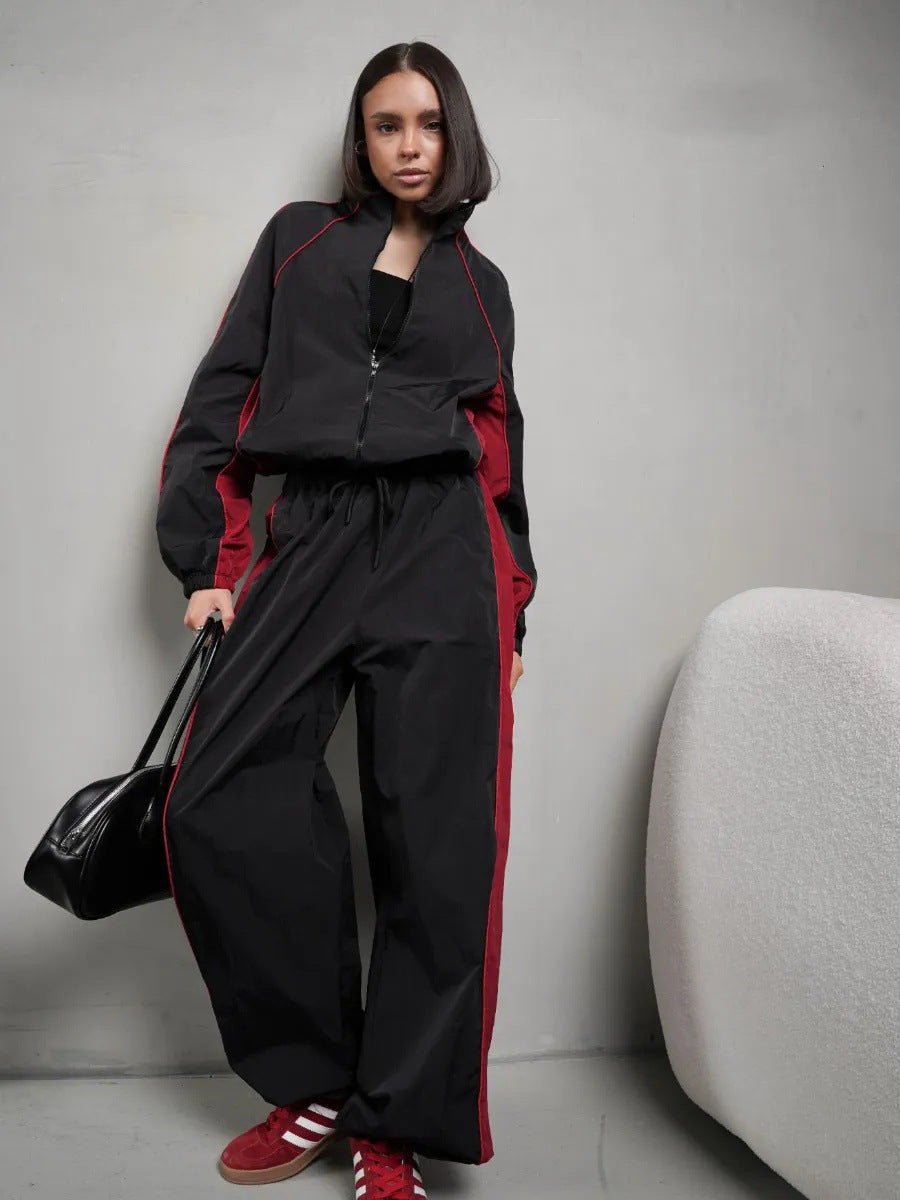Ensemble de sport élégant pour femmes avec col montant, veste zippée et pantalon à large bande latérale Echo Archiv