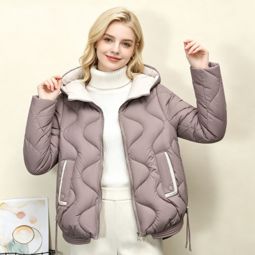 Veste courte matelassée pour femmes avec piquage en forme de cœur, ourlet arrondi et poches à rabat passepoilées Echo Archiv