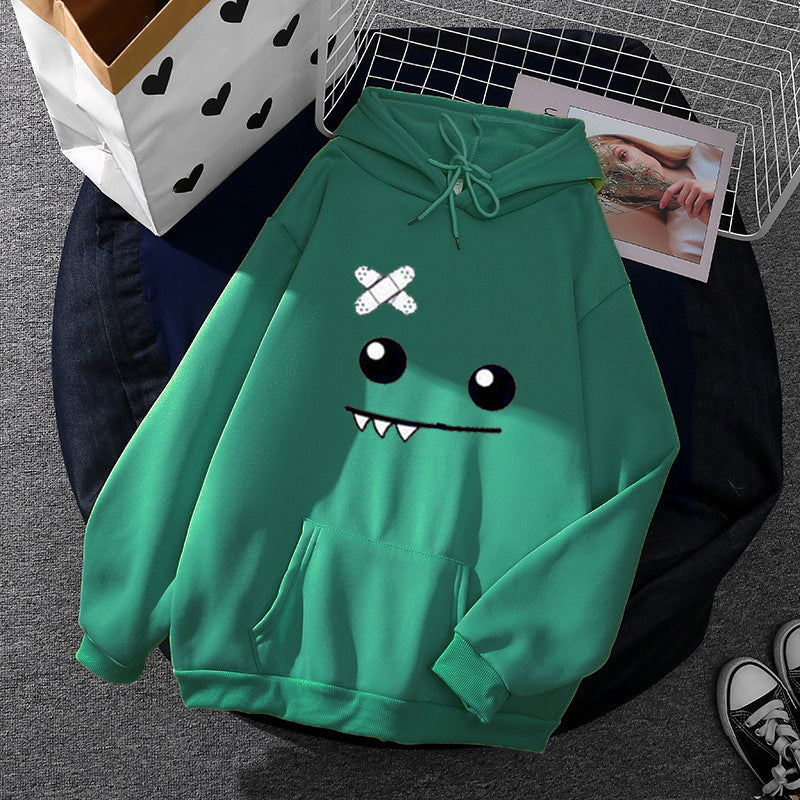 Sweat à capuche pour femmes avec un visage de monstre ludique, application de bandage et poche kangourou Echo Archiv