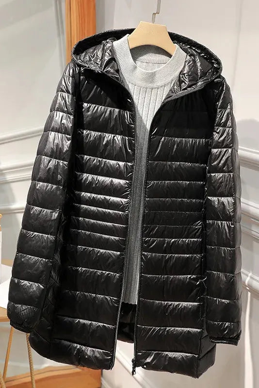 Manteau long matelassé à capuche et fermeture éclair