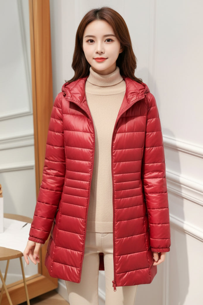 Manteau long matelassé à capuche et fermeture éclair