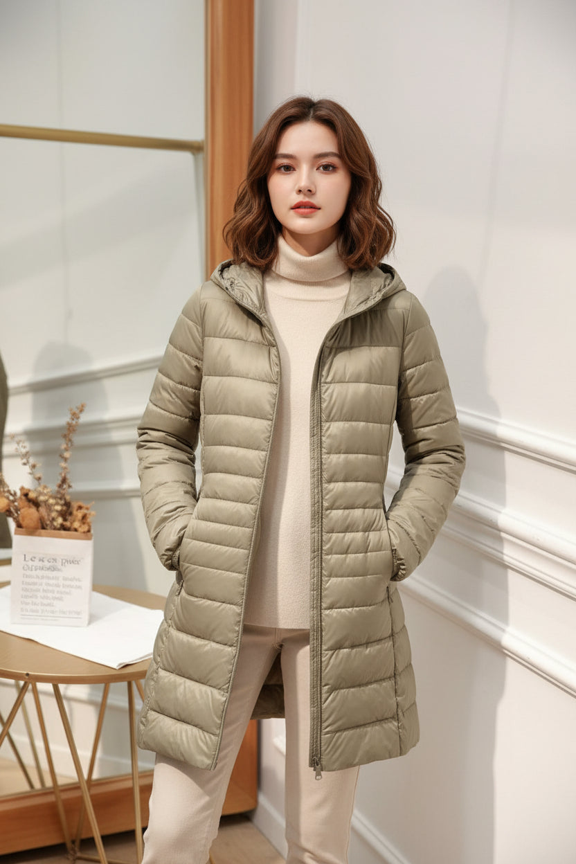 Manteau long matelassé à capuche et fermeture éclair