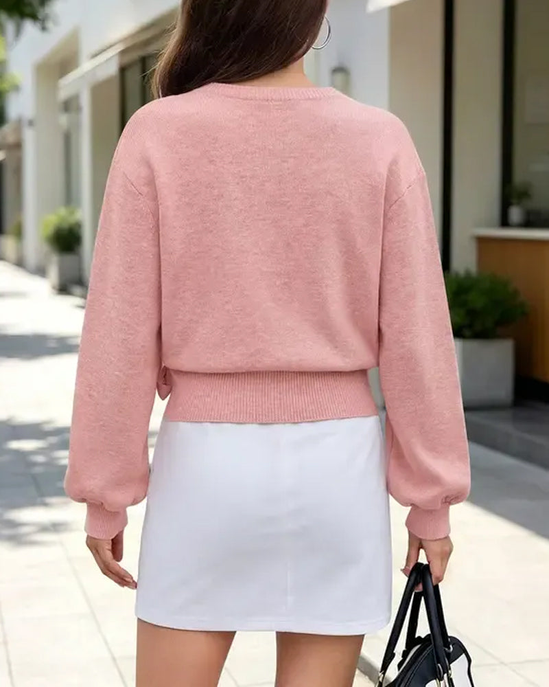 Pull court à encolure en V avec liens croisés