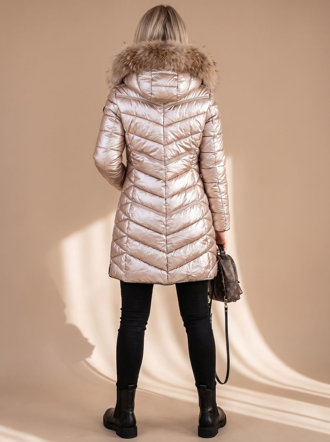 Marlene | Veste matelassée brillante pour femmes avec capuche en fausse fourrure et poches zippées