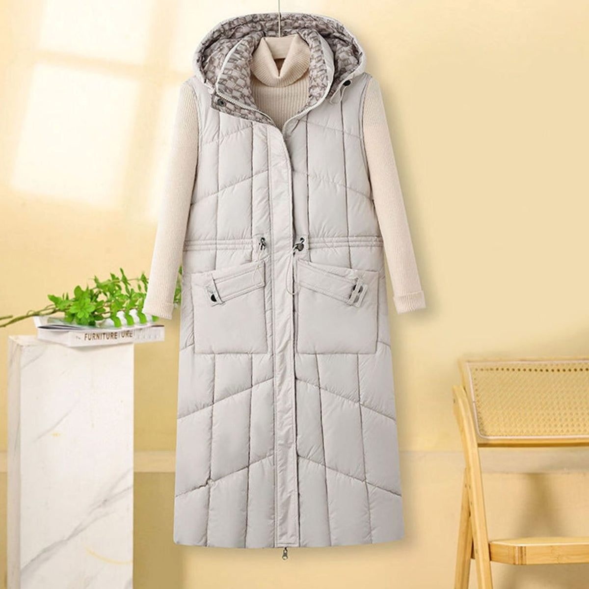 Greta | Gilet long matelassé pour femmes avec capuche et poches multifonctions
