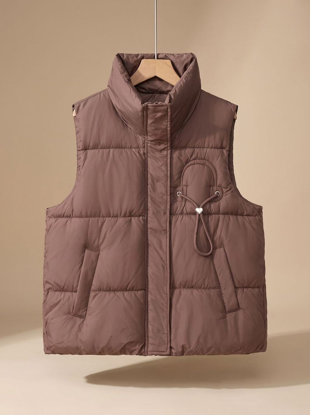 Leonie | Gilet matelassé pour femmes avec col montant et détail en cordon en forme de cœur