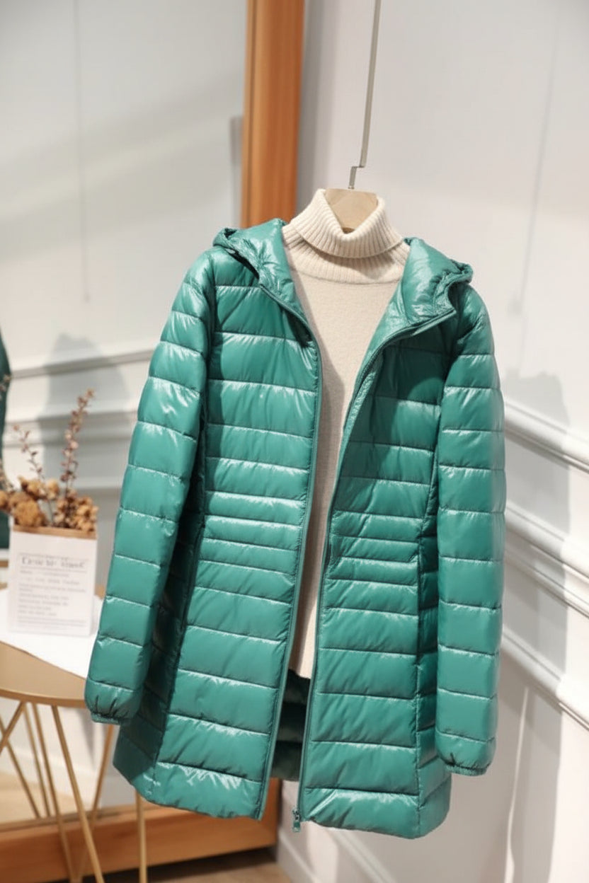 Manteau long matelassé à capuche et fermeture éclair
