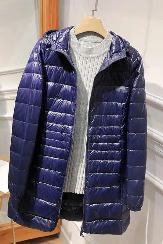 Manteau long matelassé à capuche et fermeture éclair