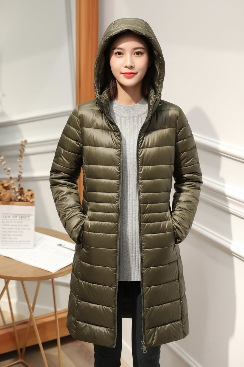 Manteau long matelassé à capuche et fermeture éclair