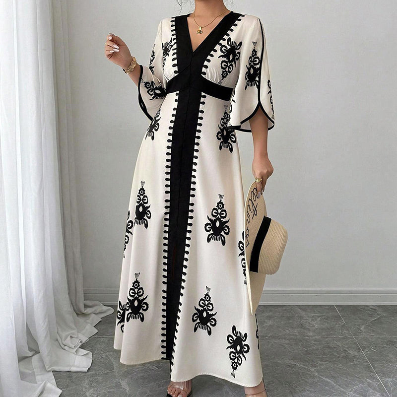 Qoucie | Robe maxi à décolleté en V avec une touche d'été élégante